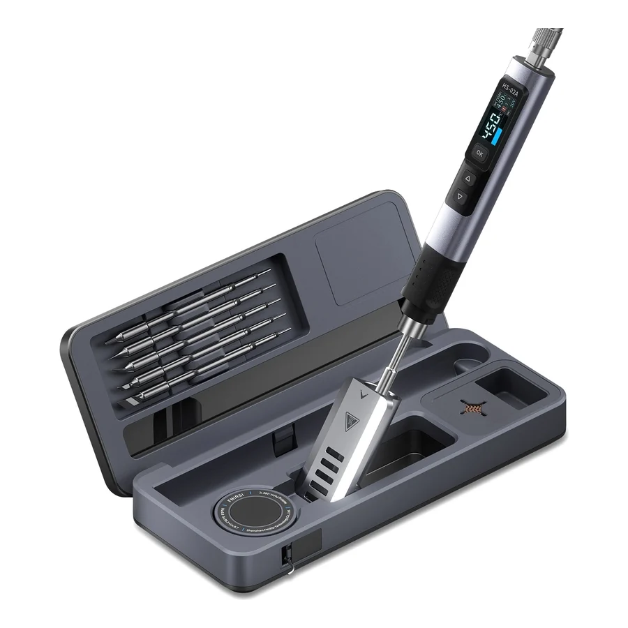 Le fer à souder FNIRSI HS-02 posé sur son coffret de rangement ouvert, ses pannes rangées